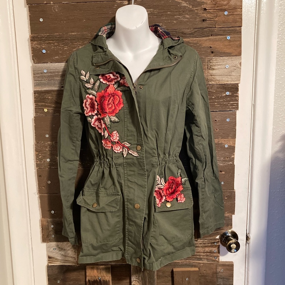 Army green, cinched waist jacket, with crocheted flower patches.